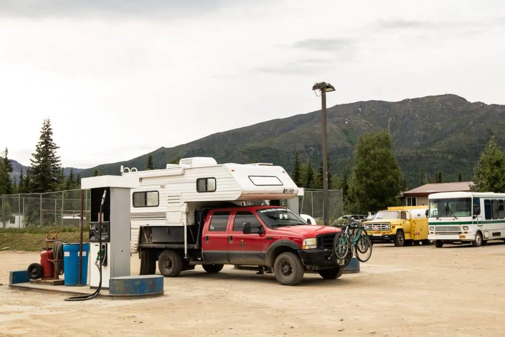Putting fuel in our truck as we drive the dalton highway in an rv truck camper