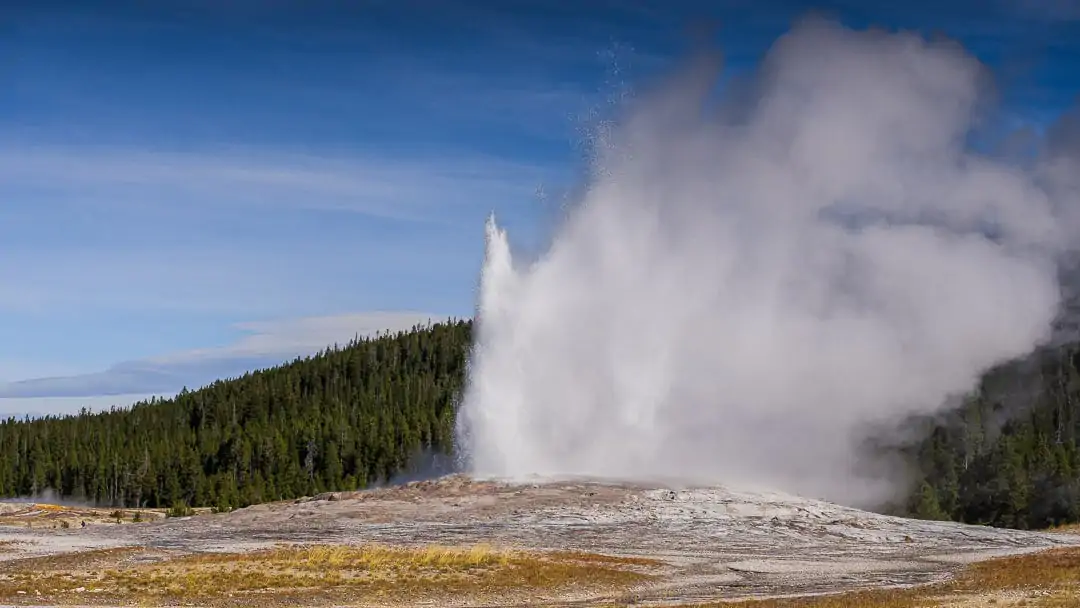 Old Faithful geyser erupting in Yellowstone 