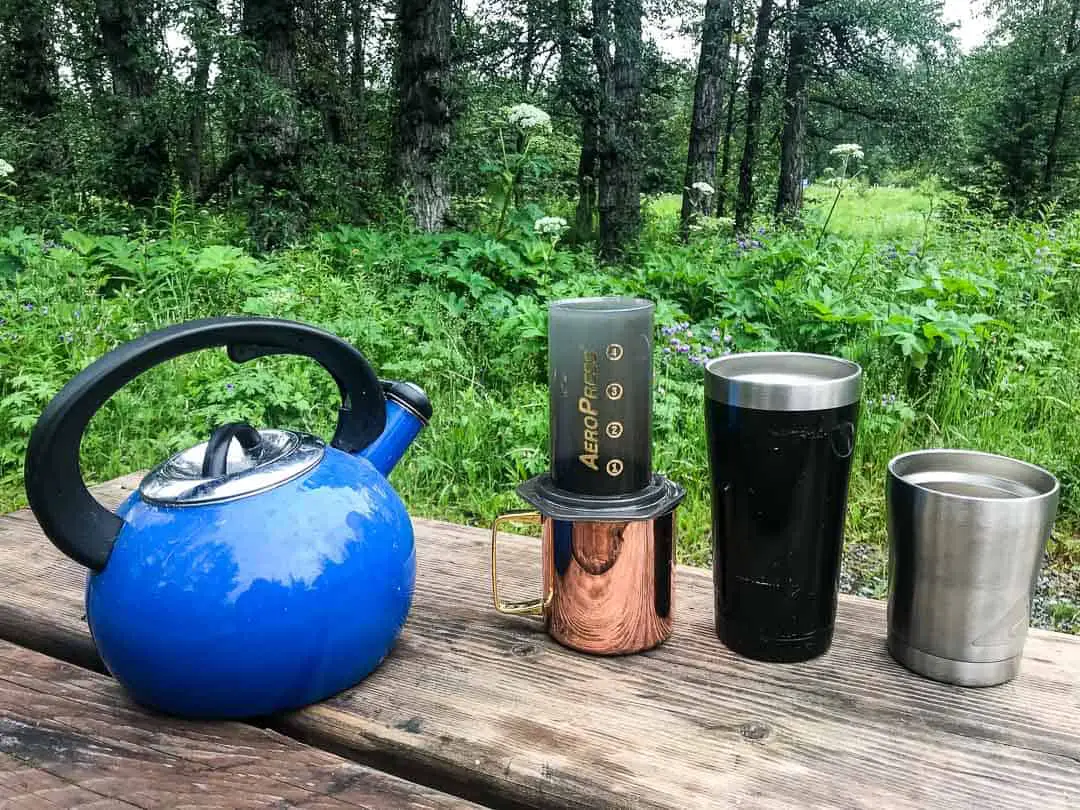 Blue tea kettle and a Aeropress coffee maker