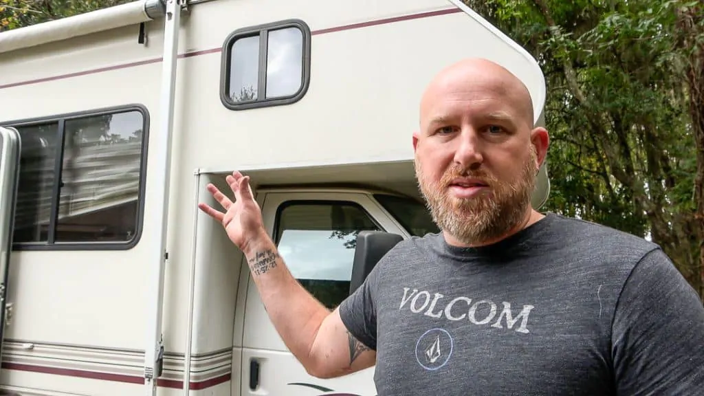 Standing in front of a used RV